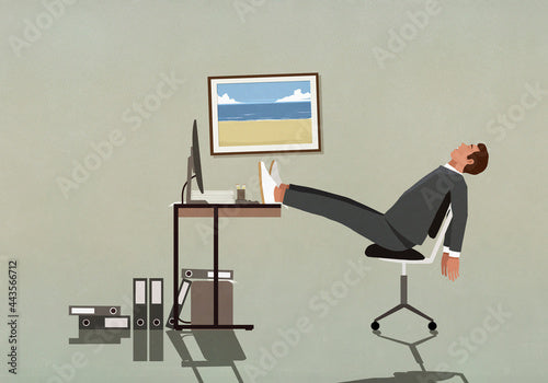 Tired businessman sleeping with feet up on desk